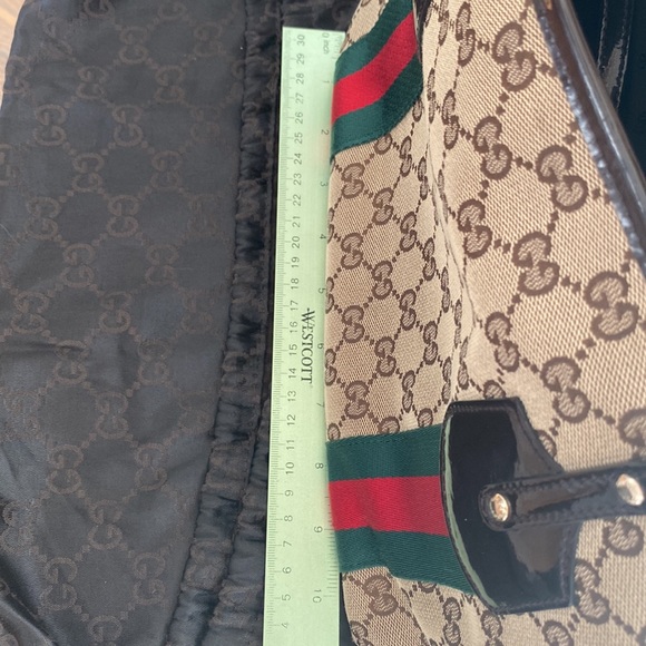 Authentic Gucci brown monogram canvas tote!With three charms.Near perfect! - Picture 14 of 14